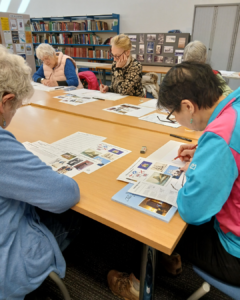 A group of carers are taking part in an illustration workshop at Berwick library