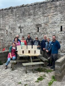 People attending a stone carving workshop in Berwick